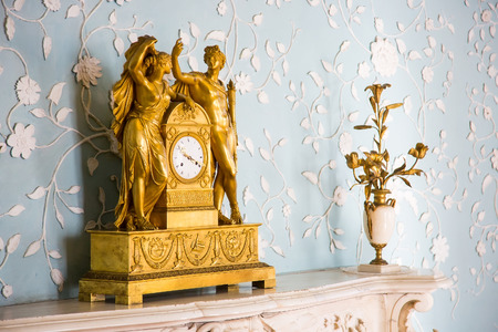 CRIMEA, RUSSIA - SEPTEMBER 25, 2014: An old fireplace clock in Vorontsov Palace in Alupka. The palace is built in 1848.のeditorial素材