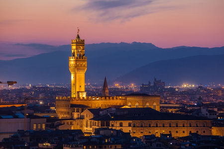 Beautiful view of Palazzo Vecchio in evening illumination and the river Arno, Florence, Italyの写真素材