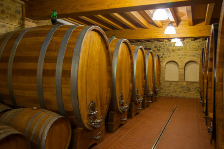 Old wooden barrels with wine
