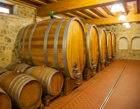 Old wooden barrels with wine
