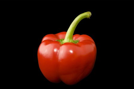 Delicious fresh red pepper croped on black background