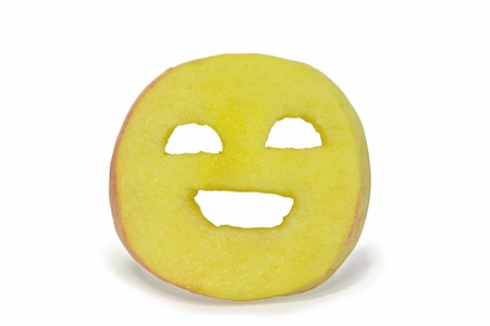 face carved out of appleの写真素材
