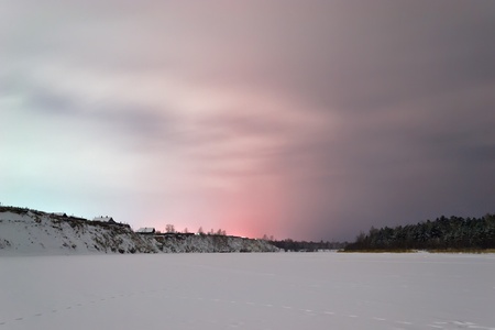 red blue sky at night over a cliff in winterの写真素材