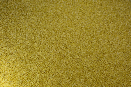 bright yellow delicious fresh standard couscous backgroundの写真素材