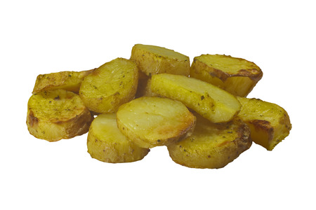 potatoes roasted in the oven isolated on white backgroundの写真素材