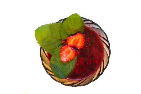 the strawberry jam with whole berries and mint leavesの写真素材