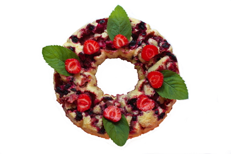 cake with strawberry jam with whole berries and mint leavesの写真素材