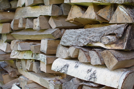 large nicely stacked pile of firewood close up