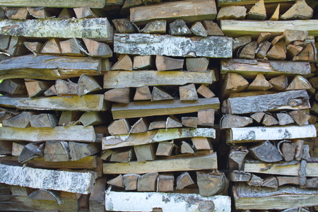 large nicely stacked pile of firewood close up