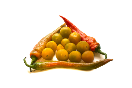 red hot chili peppers and yellow tomatoes on white backgroundの写真素材