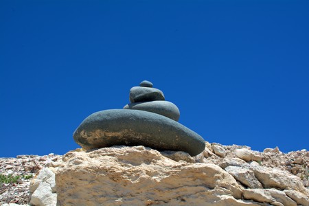 pyramid of the stones against the bright blue skyの写真素材