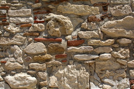 background of ancient wall made of blocks of sandstoneの写真素材