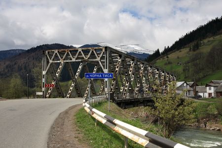The bridge through mountain river Chorna Tysa