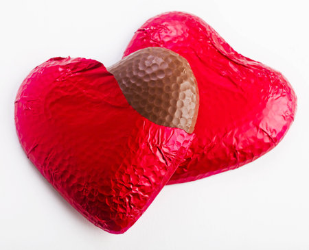 Unwrapped chocolate heartsの写真素材