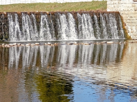 Photo captured during a walk around the river Poprad waterfall and forms part of a large cascade の写真素材