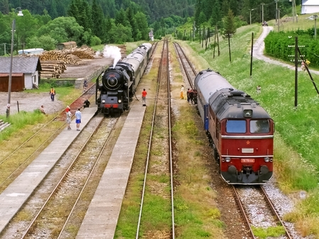 Historical photograph trains on the railway station Mlynky, steam and diesel train in the mountains of Slovak Paradise.のeditorial素材
