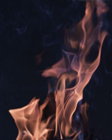 An isolated flame over black backgroundの写真素材