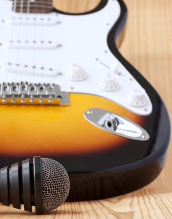 Microphone near the body of an electric guitar, shallow depth of fieldの写真素材