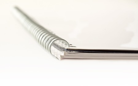 Closeup of notebook with rings, gray cover, over white backgroundの写真素材