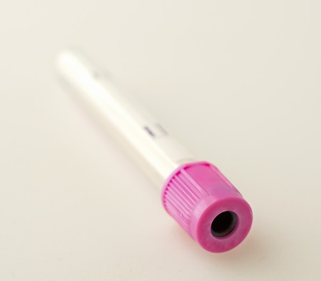 Closeup of a test tube with pink capの写真素材