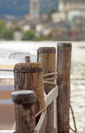 Wooden poles for ships in a lake, shallow depth of fieldの写真素材