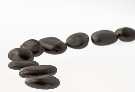 Black stones for stone massage disposed as a roadの写真素材