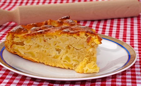 Big slice of apple pie, with rolling pin