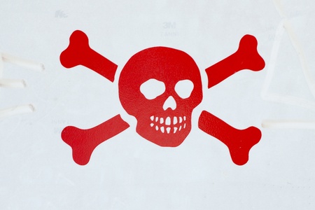 Red death symbol over a gray cartelの写真素材