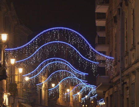 A road with lighted colourful Chrismas lightsの写真素材