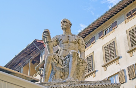 Statue of a sitting man in Florence, Italyの写真素材