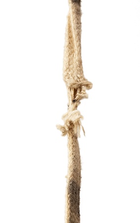 Vertical image of a breaking rope over white backgroundの写真素材