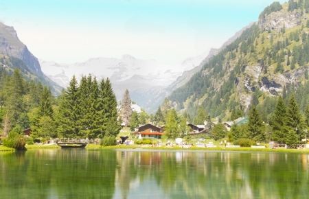View of a little lake with mountains on the background