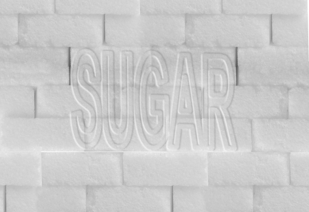 Words "Sugar" written on a wall made of blocks of sugarの写真素材