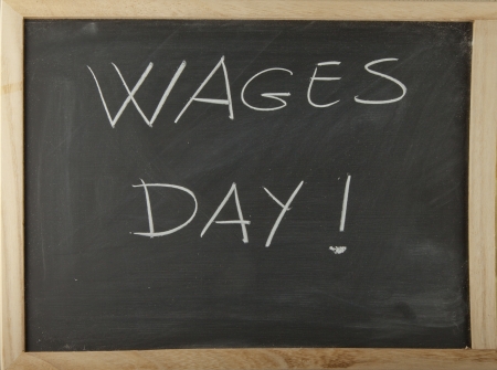 Blackboard with words "Wages day" written with chalkの写真素材