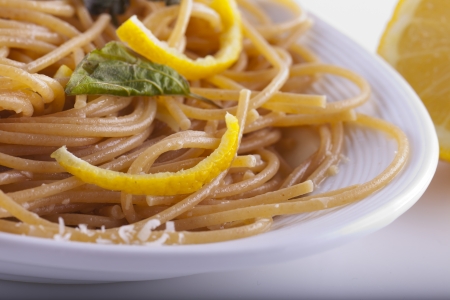 Close up of a plate with spaghetti with lemonの写真素材