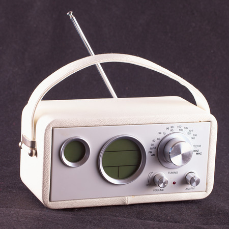 White vintage radio over black tissue backgroundの写真素材