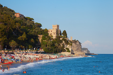 Beach and sea of Finale Ligure, Italy, with castle on the hillのeditorial素材