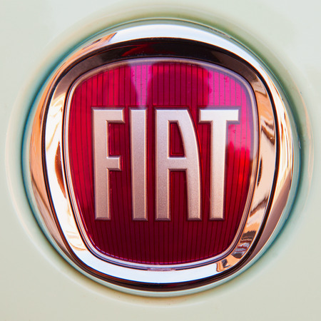 CASALE MONFERRATO, MARCH 10, 2015: Fiat symbol over green car. Fiat is a subdivision group of great autumobiles group FCA.のeditorial素材