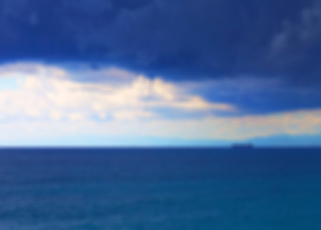 Sea blurred background of whirlwind over the sea, with ships at the horizon, horizontal imageの写真素材