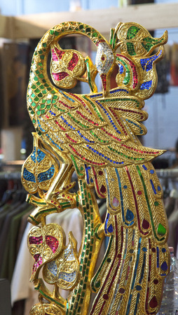 TURIN, MARCH 27, 2015: Golden decoration in shape of bird at the "Festival dell'Oriente", a great fair about oriental disciplinesのeditorial素材
