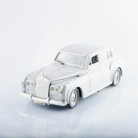 CASALE MONFERRATO, AUGUST 11, 2015: Rolls Royce Silver Cloud toy car model, over reflectig surface, made by Italian factory Polystil, scale 1:30のeditorial素材