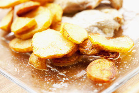 Potatoes over glass plate, shallow depth of field, horizontal imageの写真素材