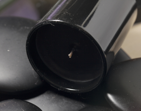 Black candle and stones, close up, horizontal imageの写真素材