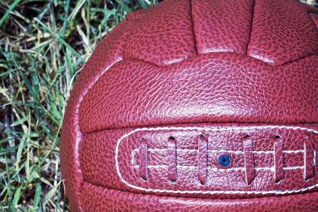 Vintage football over grass field, square imageの写真素材