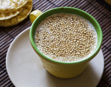 Quinoa flakes in milk cup, horizontal imageの写真素材
