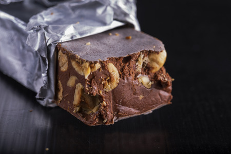 Torrone in close up, typical Italian sweet food, with black copyspace on the right, horizontal imageの写真素材