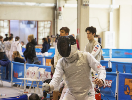 CASALE MONFERRATO, ITALY - FEBRUARY 25, 2017: Fencer in a match at Italian fence Championships in...
