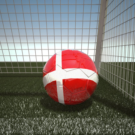 Denmark flag on soccer ball in net, 3d renderの写真素材