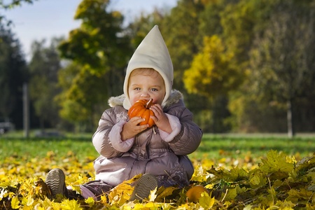 Cute baby with pumpkinの写真素材