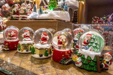 Christmas and New Year holidays decoration with snow globe, Santa Claus and snowmanの写真素材